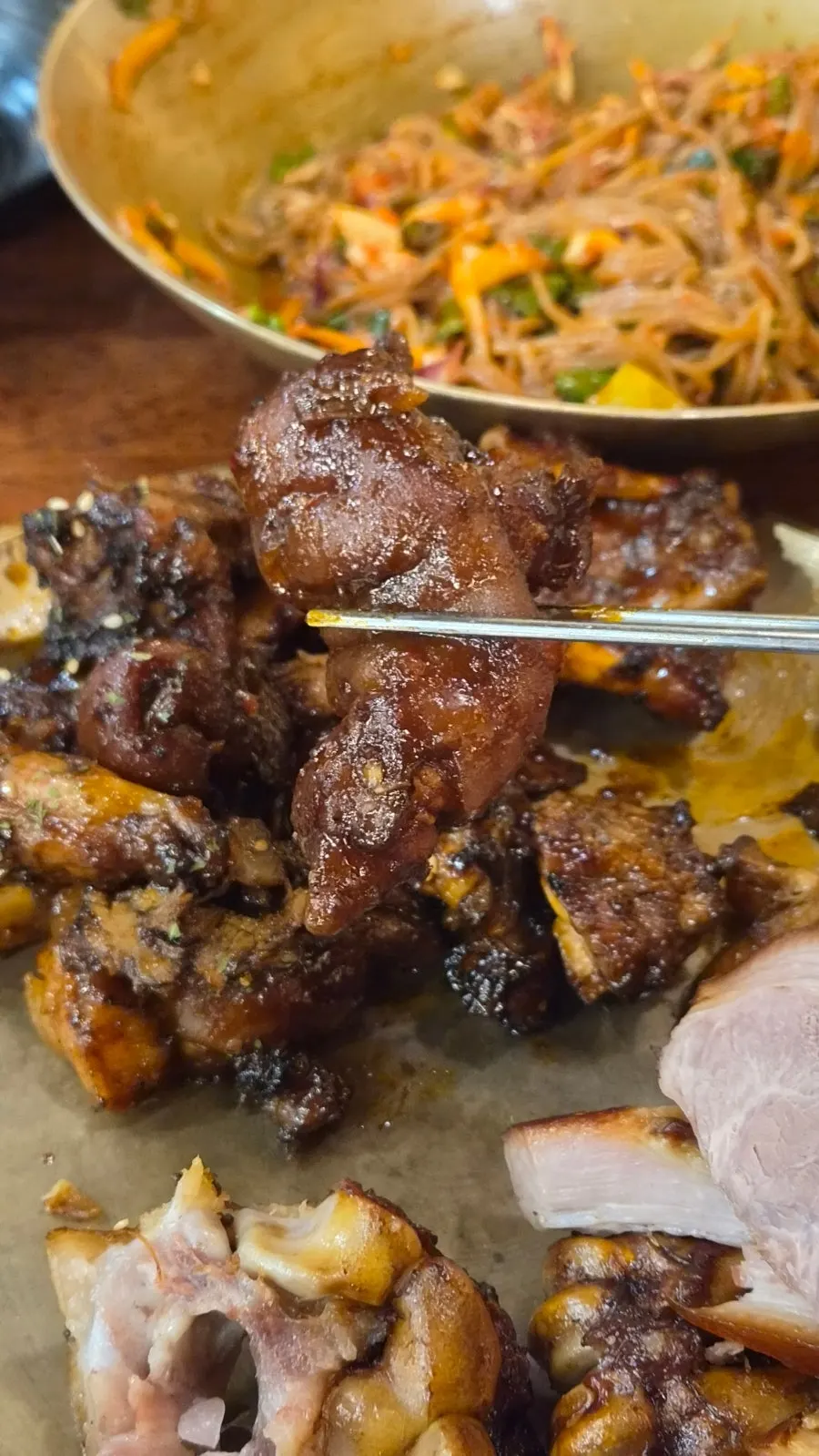 Fire-grilled spicy jjokbal wrapped in salad leaves