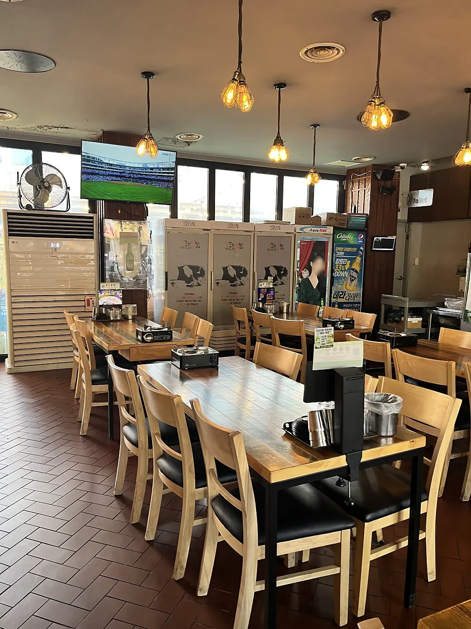 Screen and seating on the opposite side of the dining room