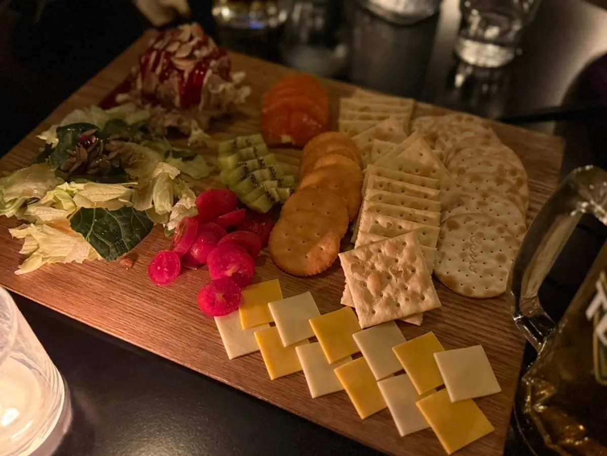Tuna cracker platter served on a wooden board