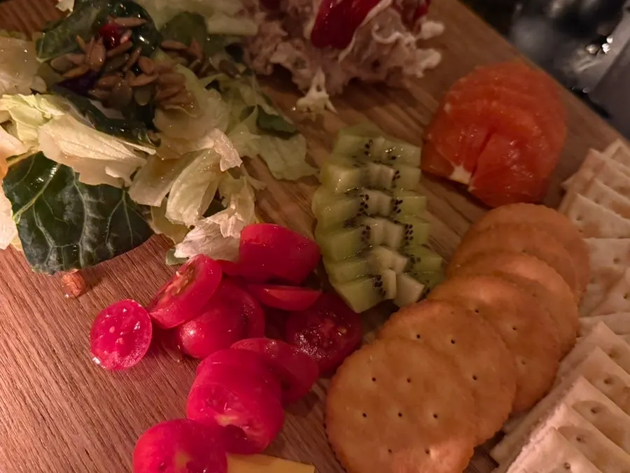 Platter with crackers, cheese, and fruit