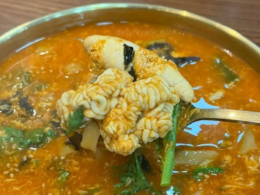 A bowl of spicy red-broth roe and milt jang kalguksu