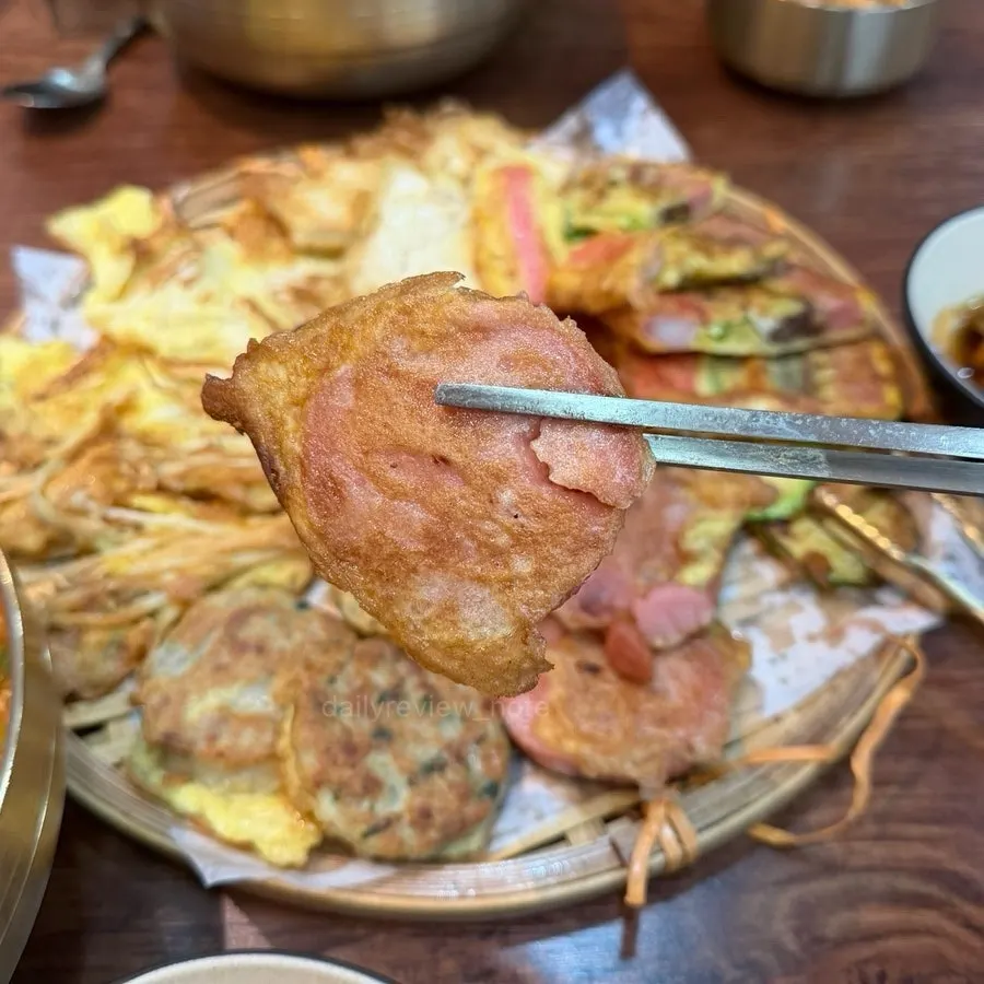 A bamboo tray filled with assorted jeon