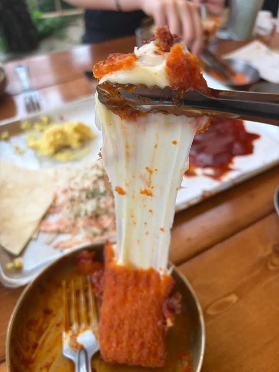 Chili's cheese split open showing stretchy melted cheese