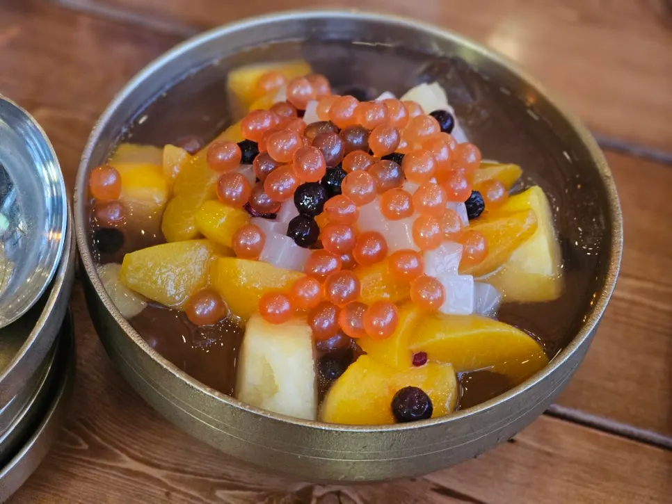 Complimentary fruit punch served in a brass bowl