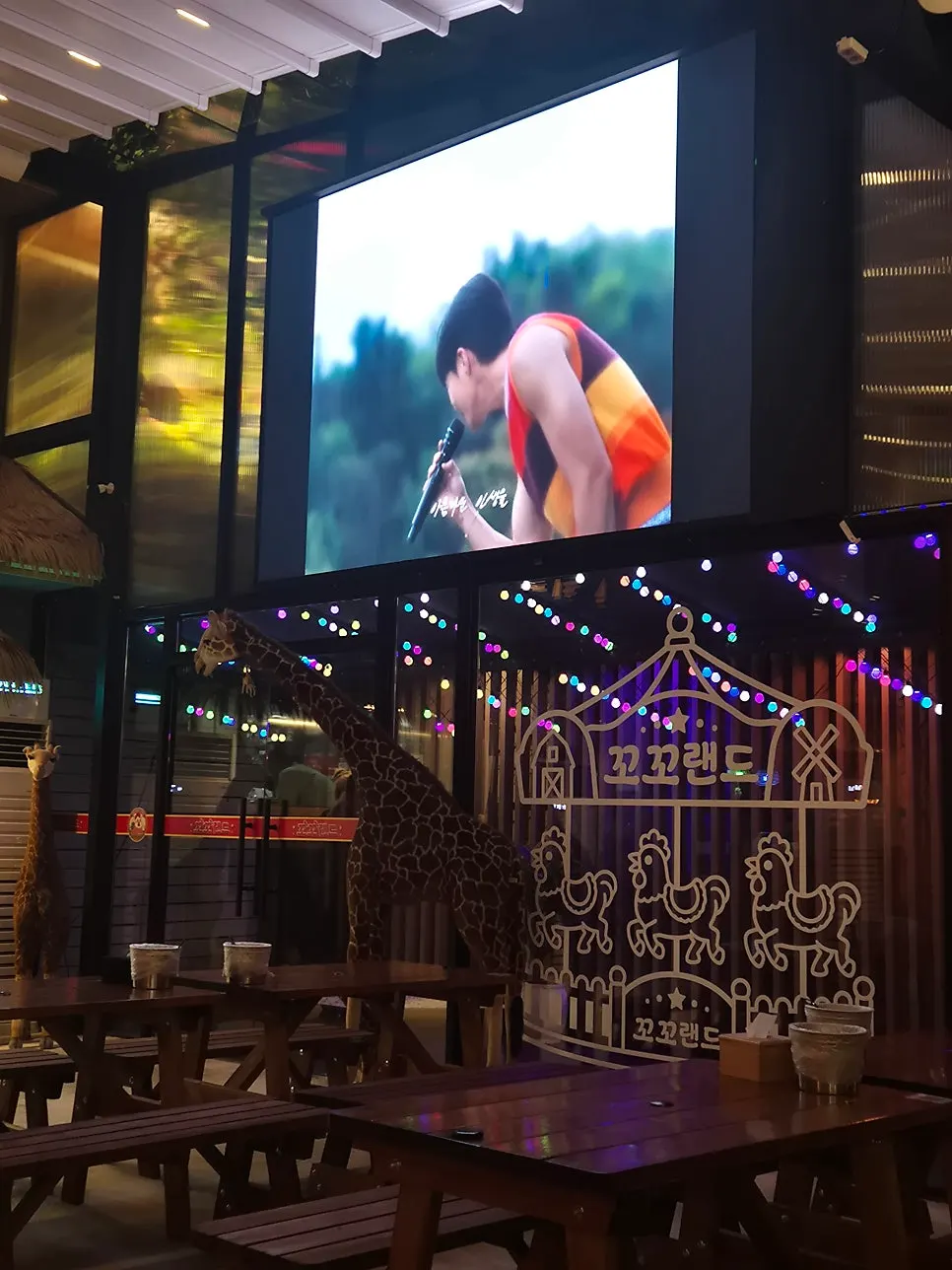 Vertical shot of the hall with the large screen visible