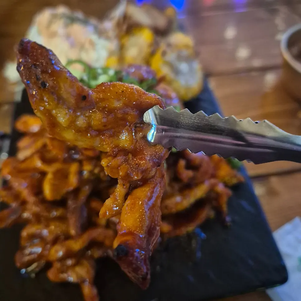 A piece of smoky sauced chicken neck