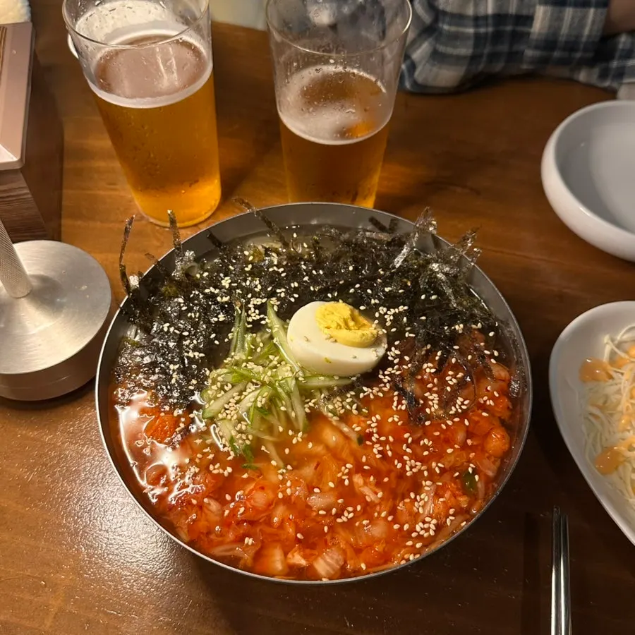 A bowl of kimchi noodle soup