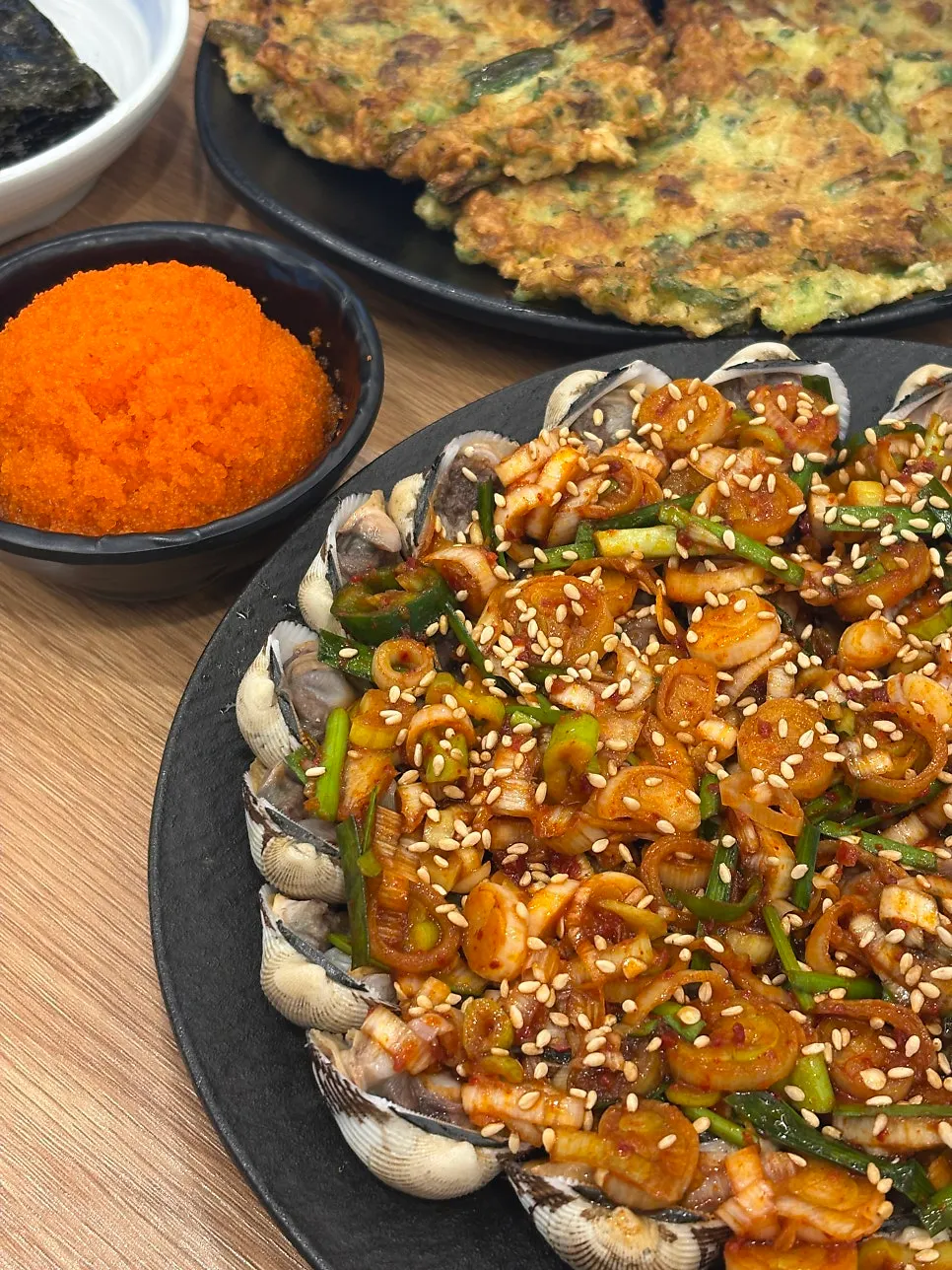 Flying fish roe topped on seasoned cockles