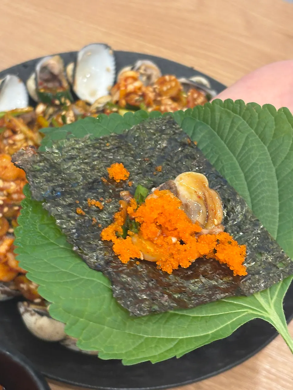Cockle wrap with seaweed, perilla leaf, and flying fish roe