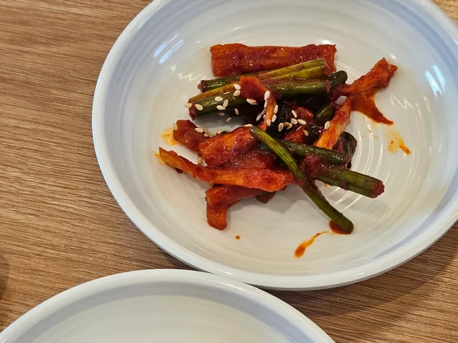 Dried radish strips and white kimchi side dishes