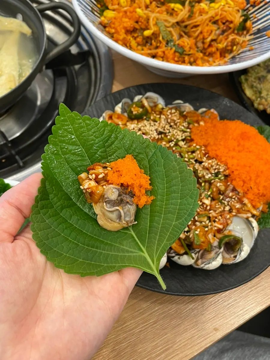 Seasoned cockles, medium size, topped with flying fish roe