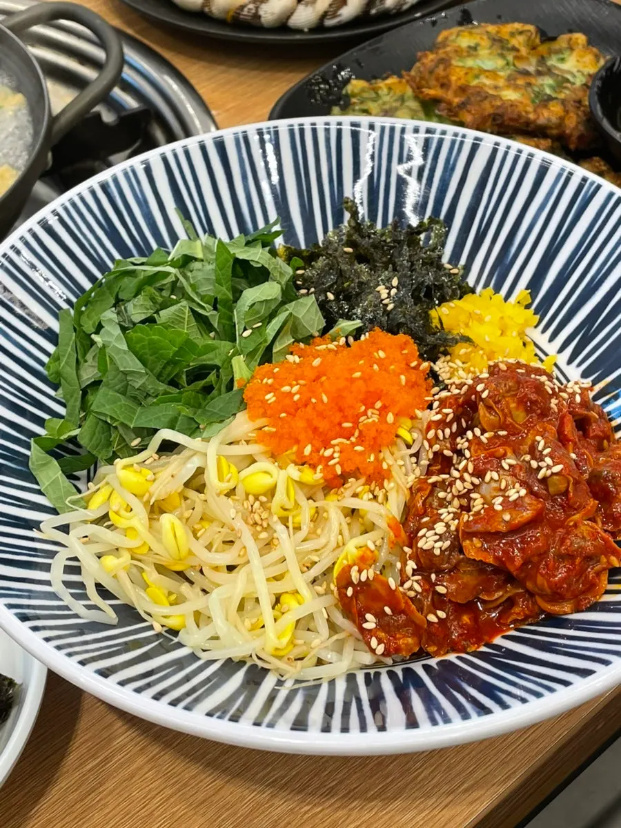 A spoonful of soy sauce cockle bibimbap