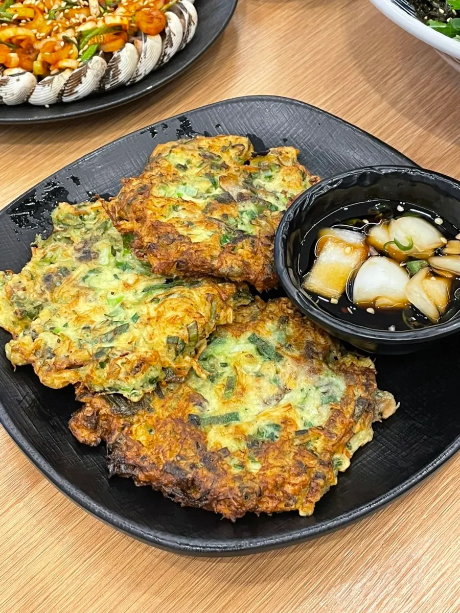 A golden-fried piece of cockle pancake