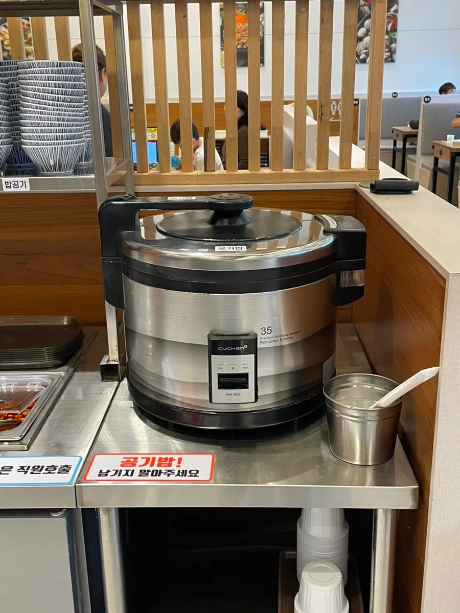 Self-bar with free rice and a microwave