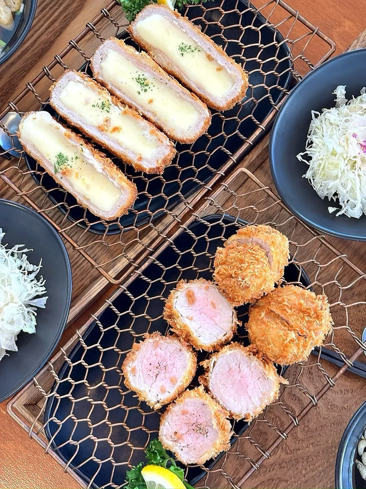 Full spread of the tenderloin and cheese cutlet suudong sets