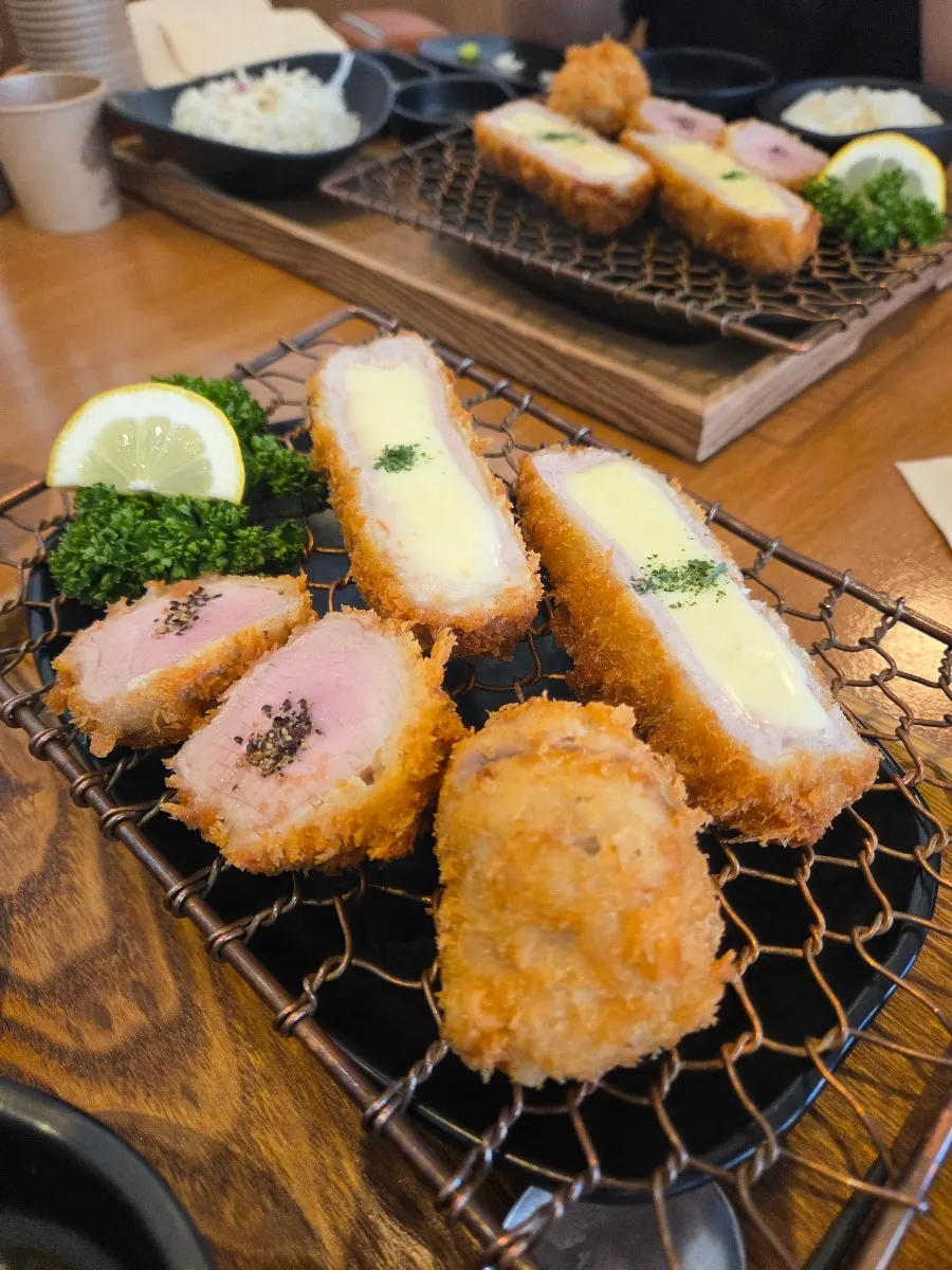 Cross-section of a crispy-outside, juicy-inside Kkot Gatsu cutlet