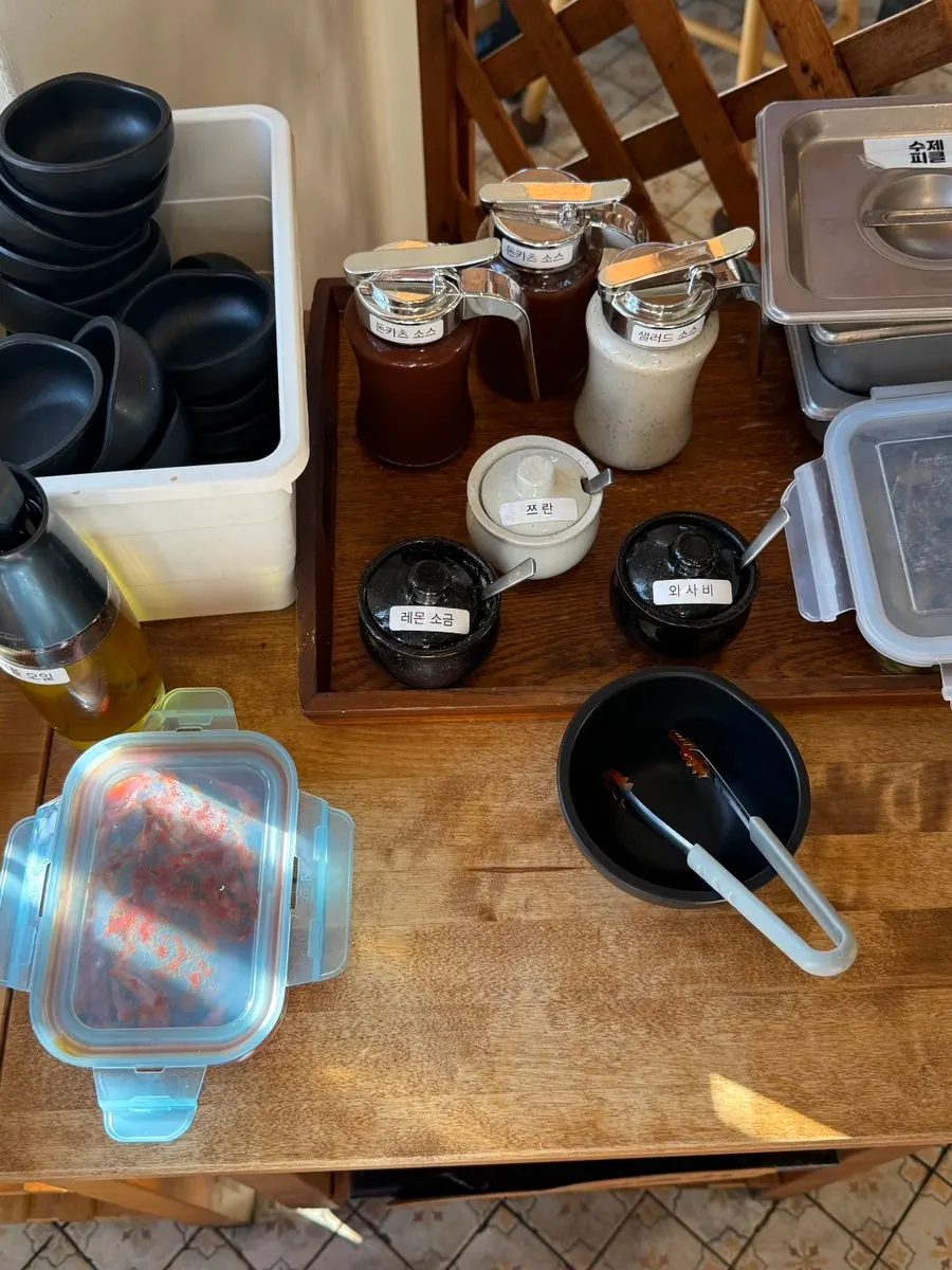 Cumin and various sauces at the Kkot Gatsu self-serve bar