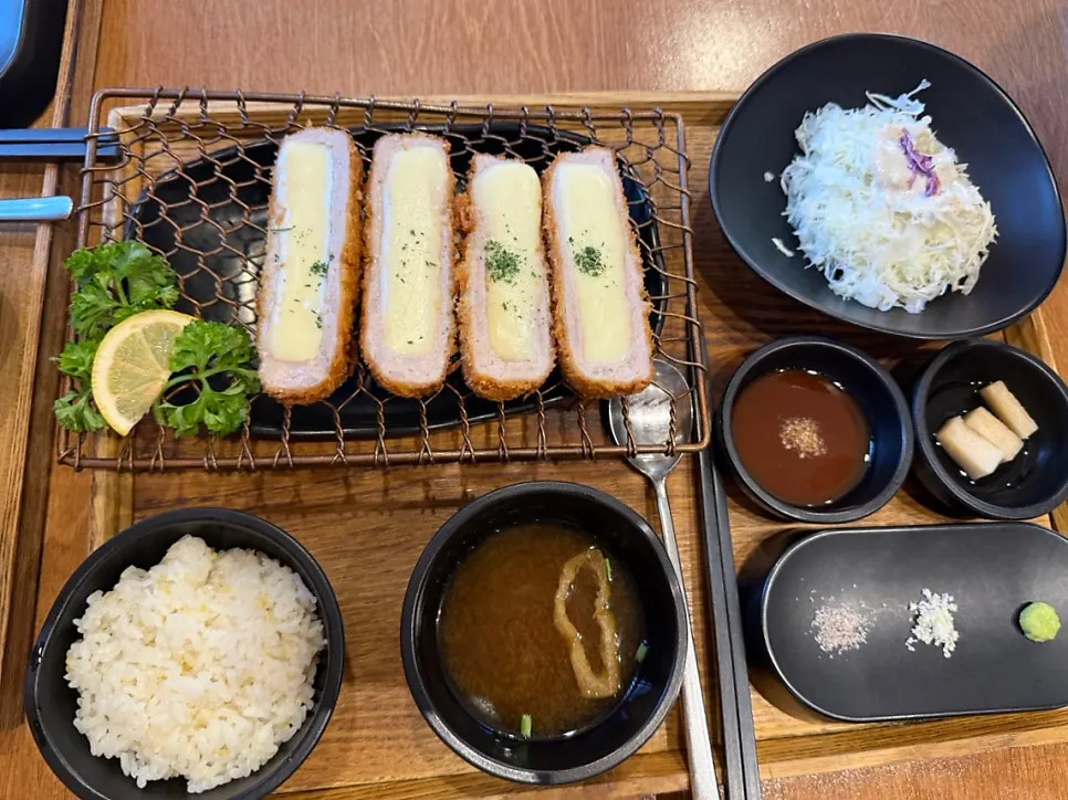A plate of Kkot Gatsu cutlet with moist meat