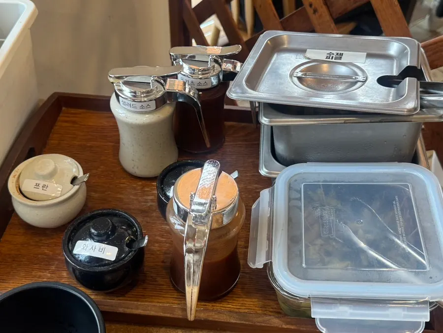 Self-serve bar with sauces and side dishes