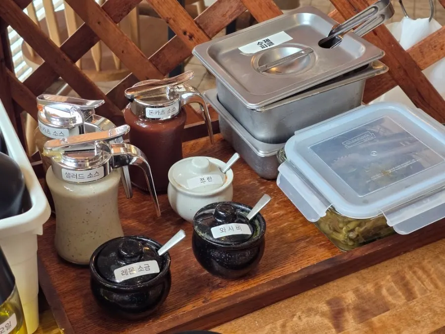 Labeled sauce station at the self-serve bar