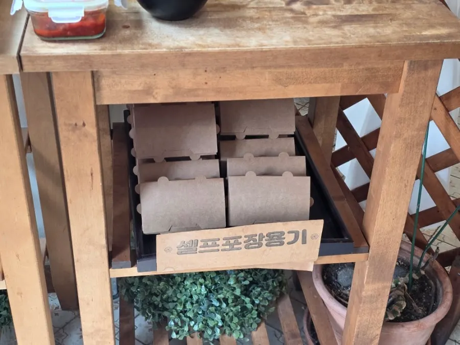 Pre-folded self-packaging containers