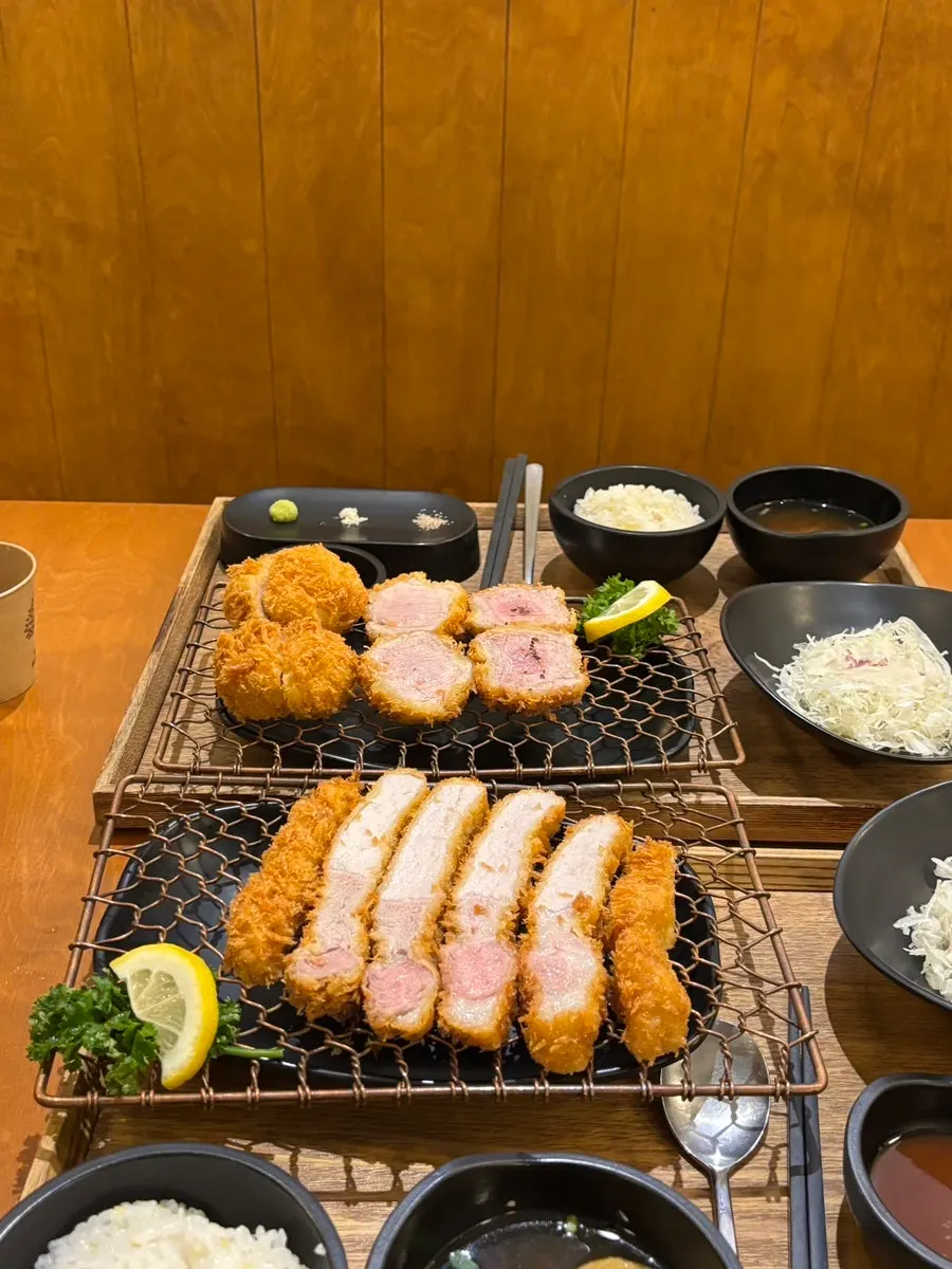Two set meals of Kkot Gatsu and special loin cutlet side by side