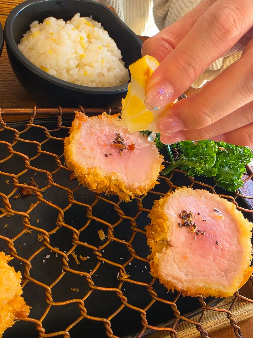 A piece of cutlet topped with wasabi