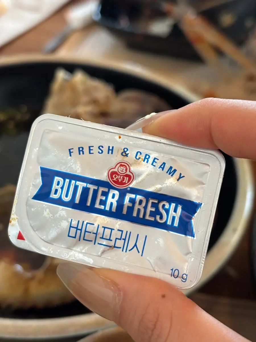 Rice mixed into a crab shell still full of guts
