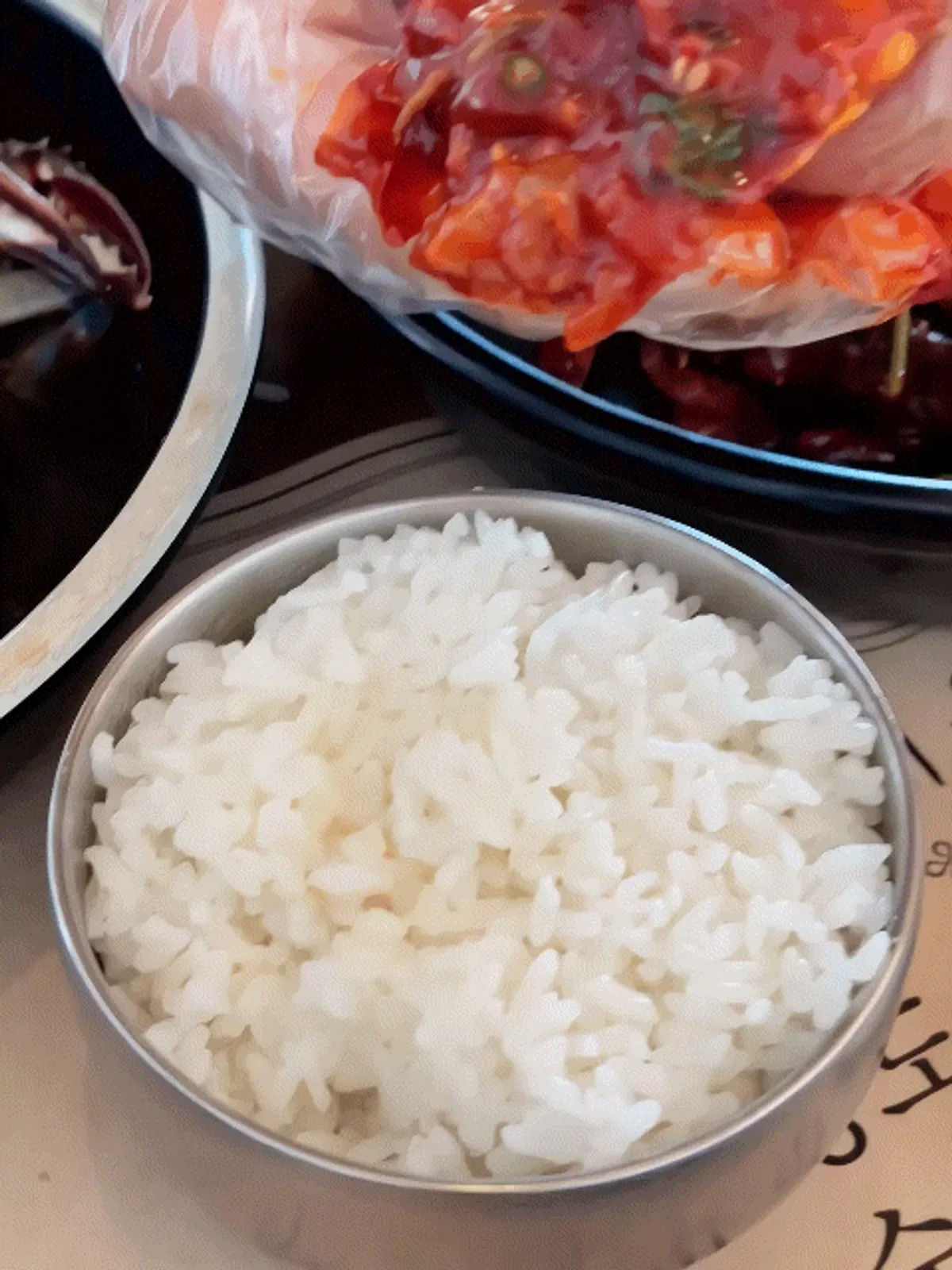 Kkotgeok's spicy marinated crab topped with minari and chili peppers