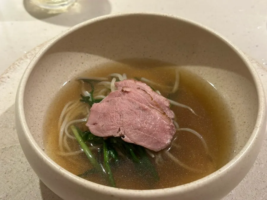Light broth served alongside the eel donburi