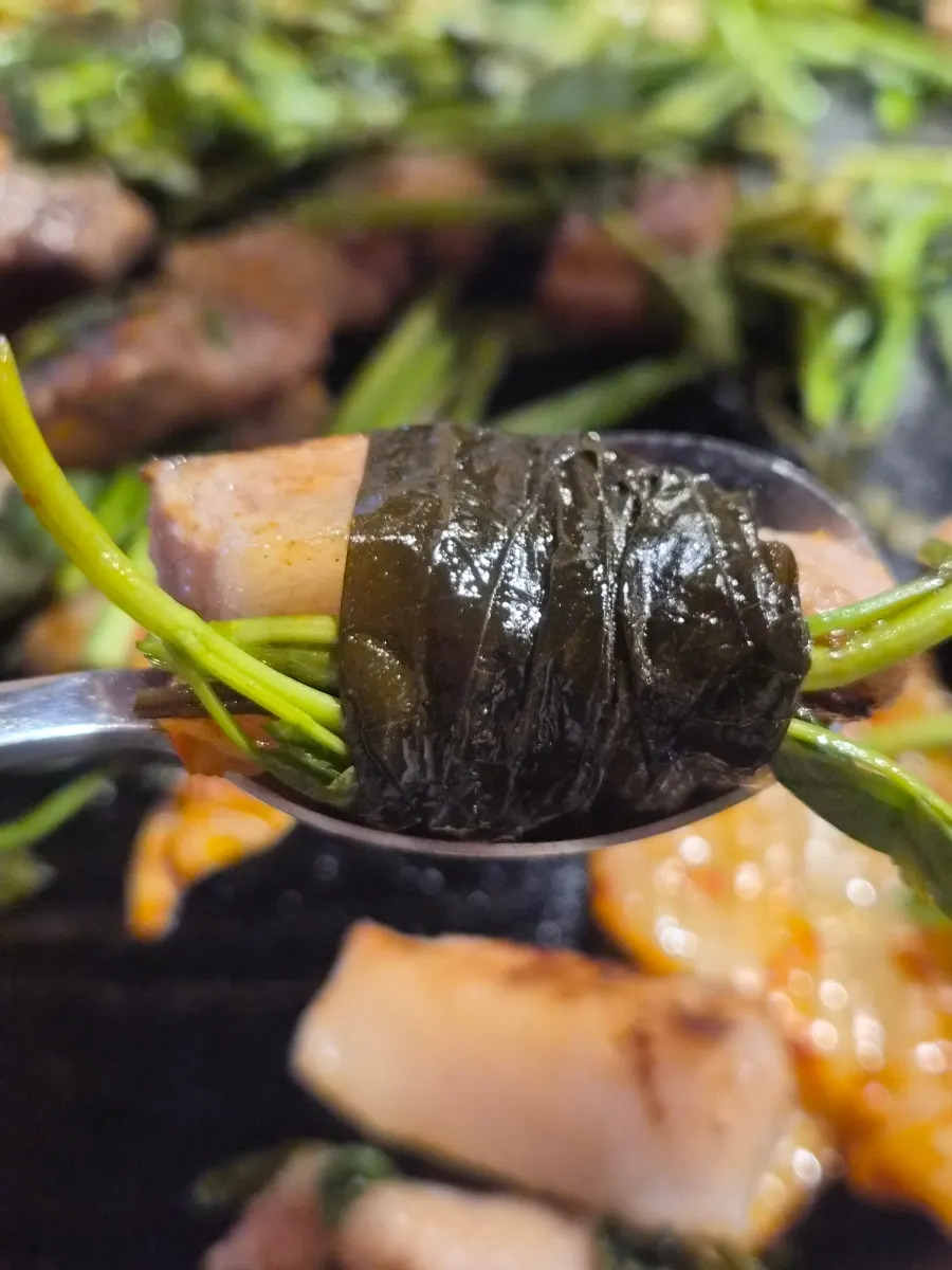 Pork belly covered and cooked with minari