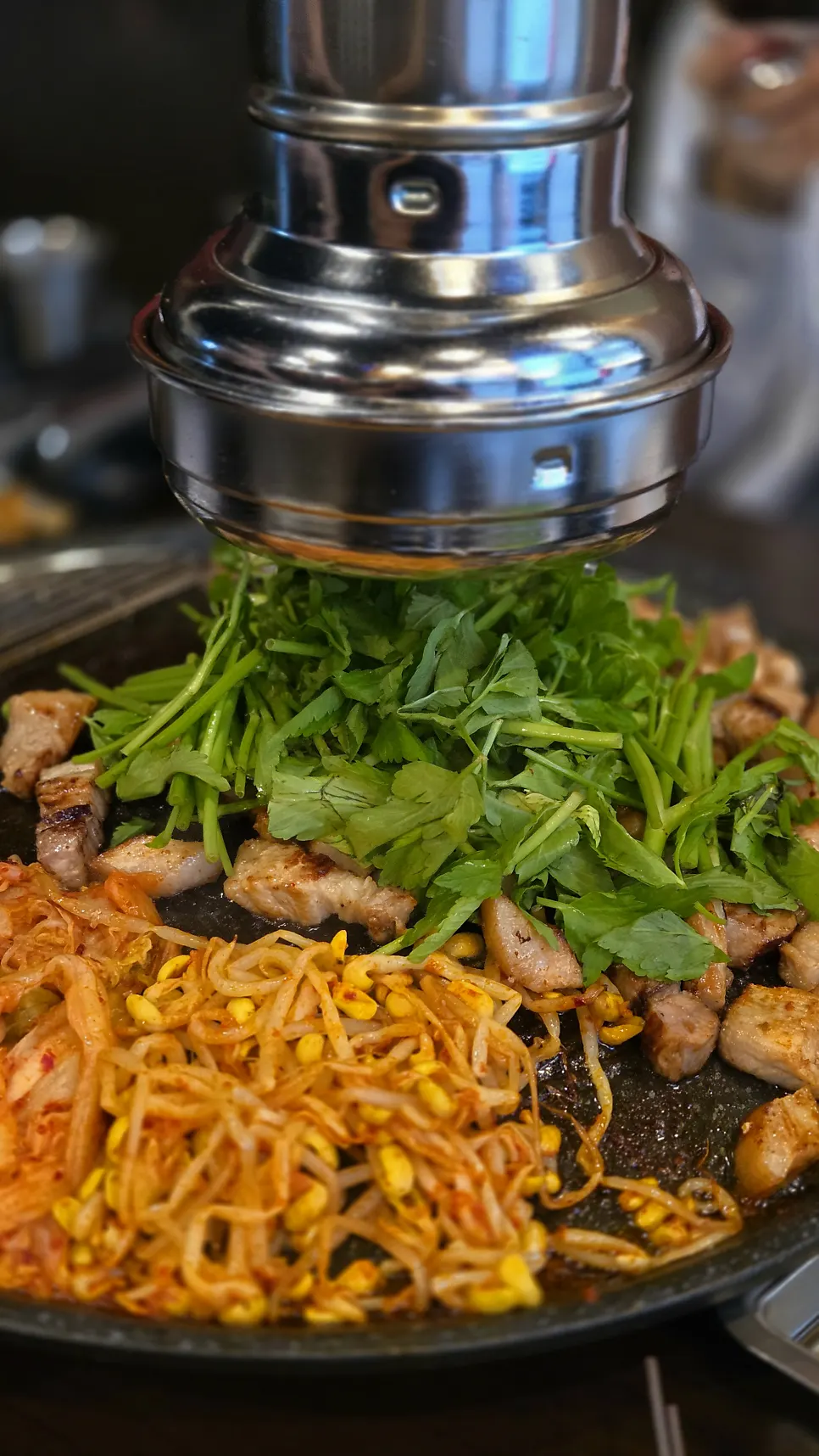 A plate of well-grilled pork belly and jowl