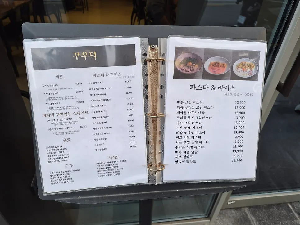 Waitlist registration machine and menu board outside the restaurant