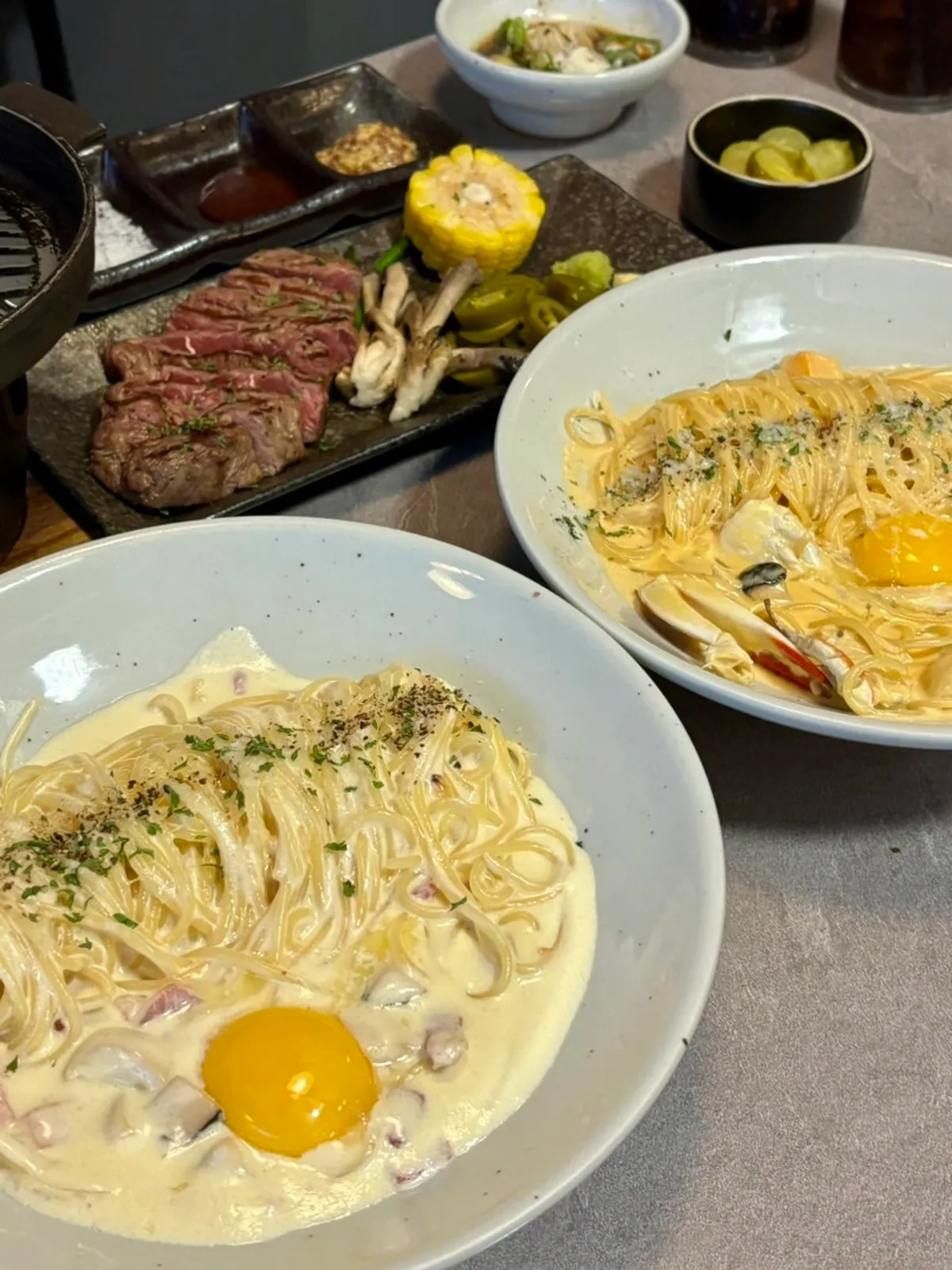 Empty plates after finishing the cream pasta and steak