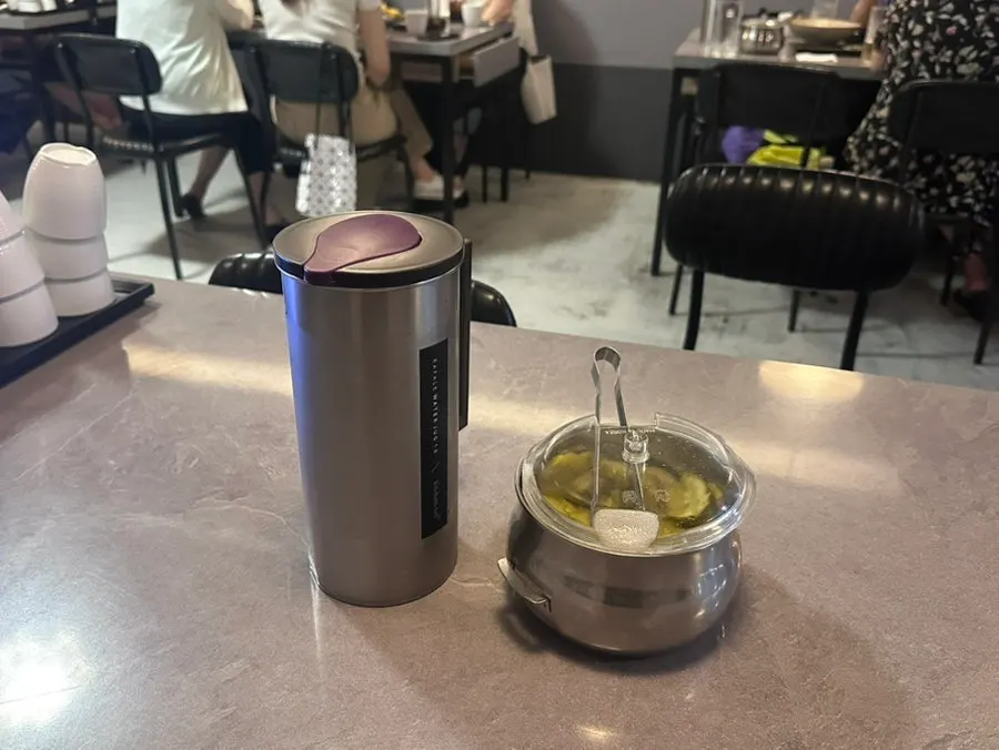 Water and pickles set on the table