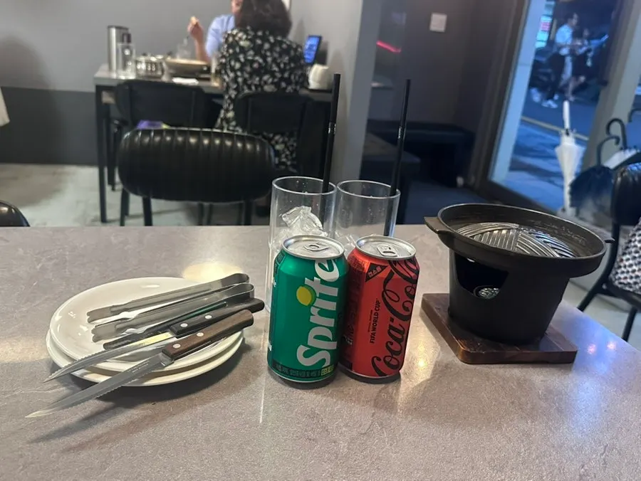 Drinks and mini table brazier served first