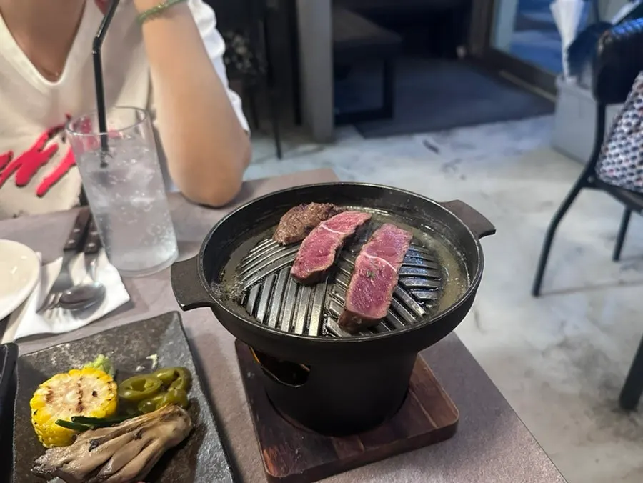 Steak grilling on the mini brazier