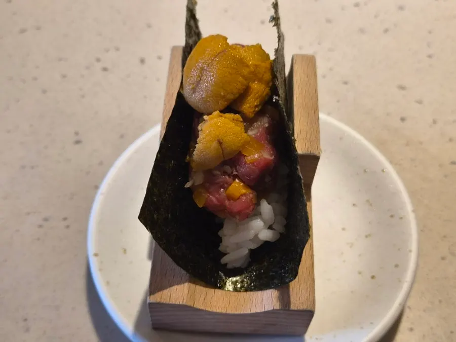 Close-up of hanwoo uni maki with pre-scored seaweed