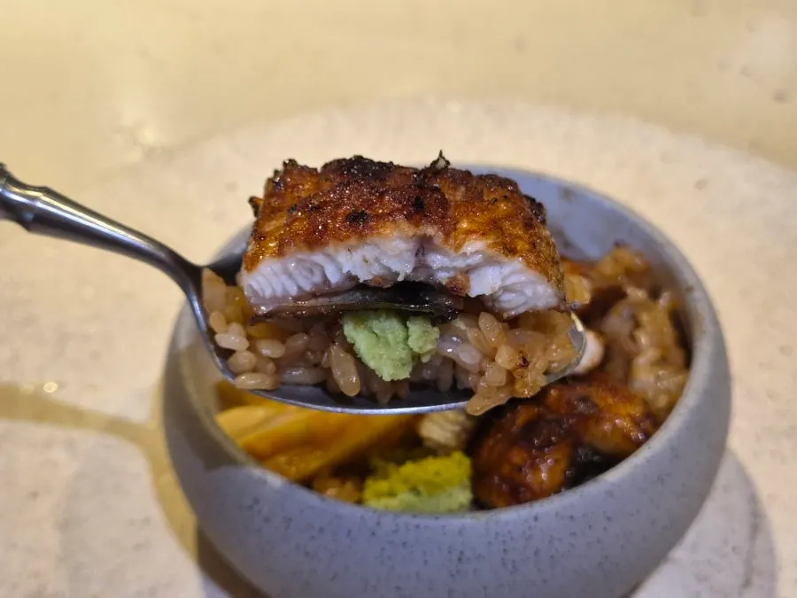 Eel donburi topped with pickled melon, served with miso soup