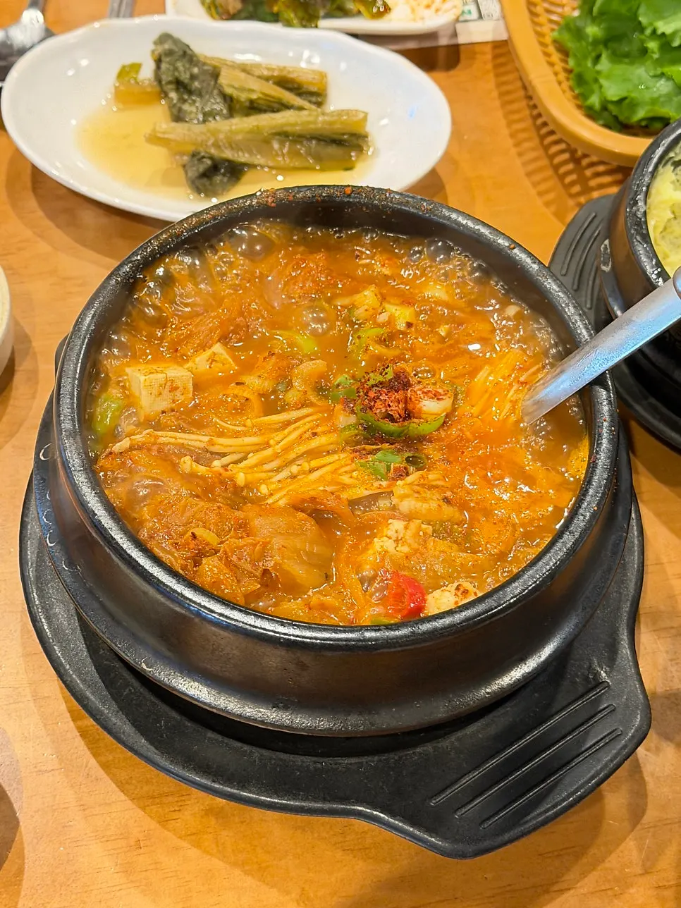 A bowl of pork-packed kimchi stew