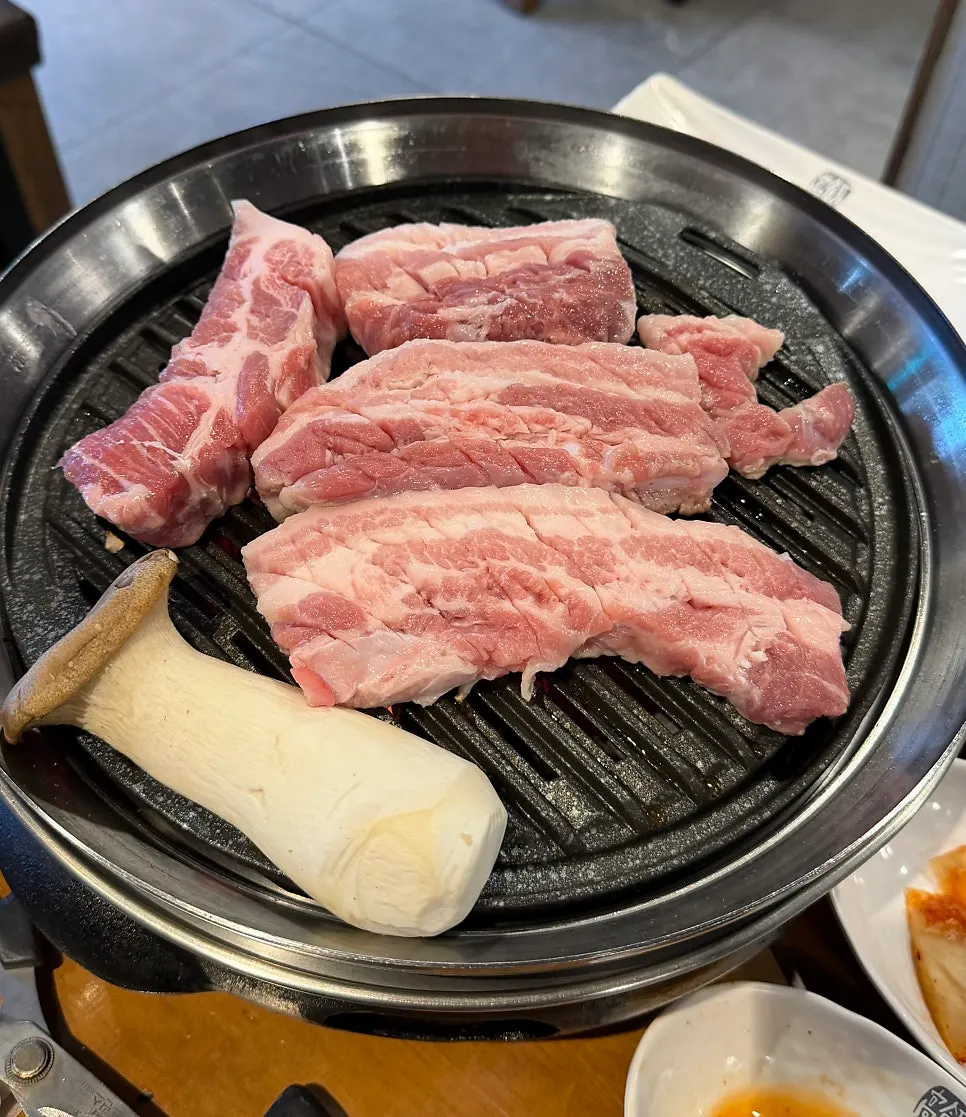 Pork belly cooking on the grill