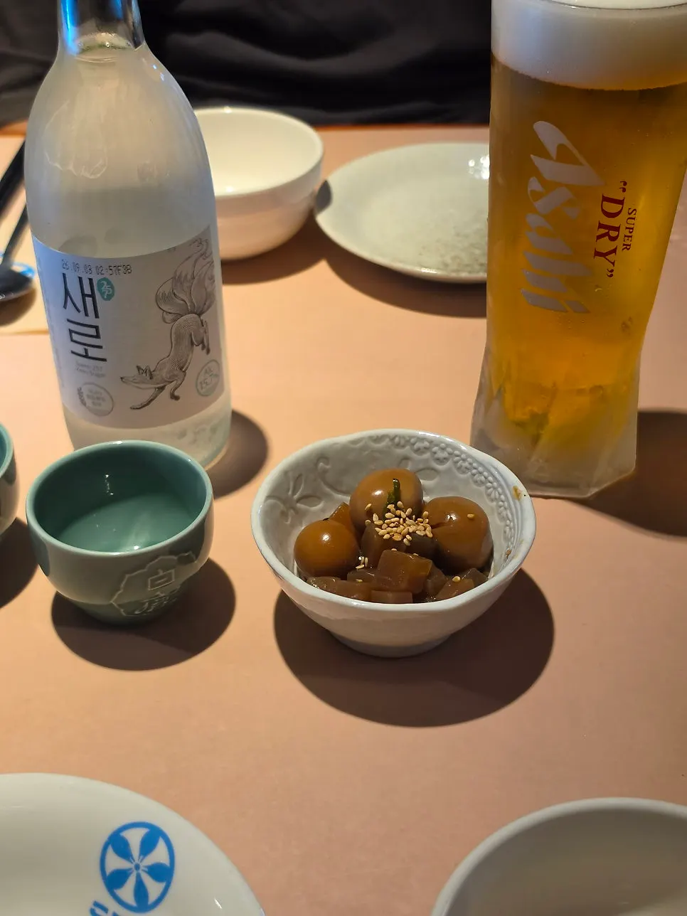 Saero, Asahi draft beer, and complimentary side dish spread