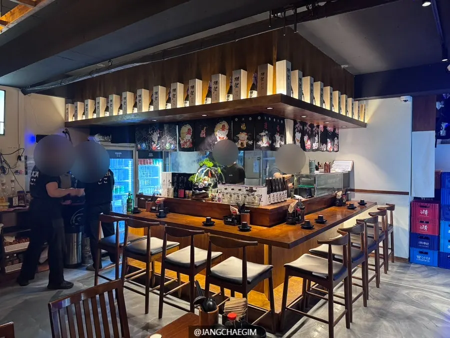 Counter seats and hall tables inside Izakaya Goko
