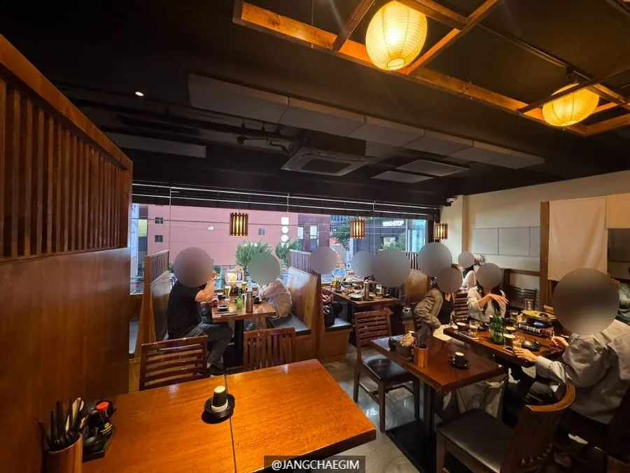 Hall tables and lighting atmosphere at Izakaya Goko
