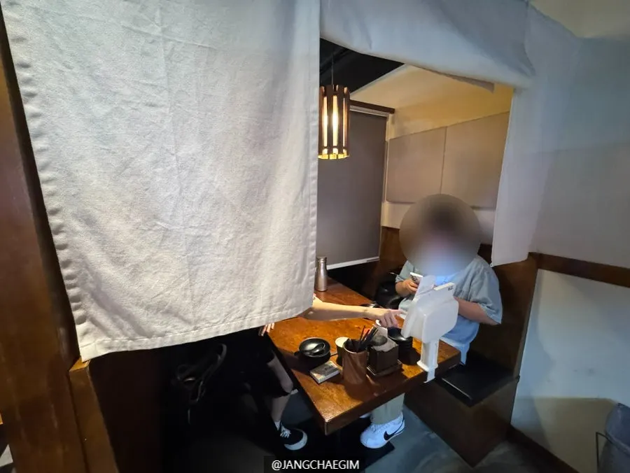 Curtained private booth at Izakaya Goko