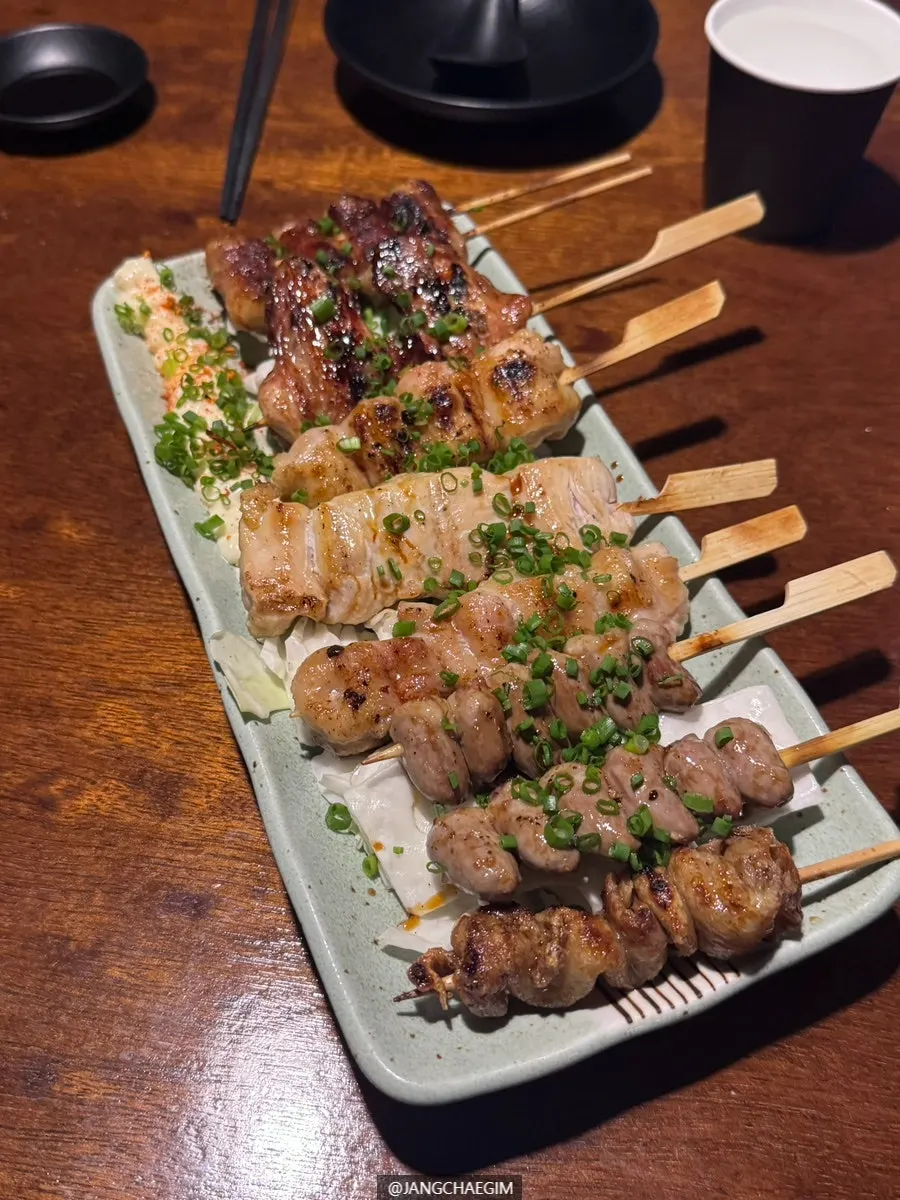 Yakitori skewers of heart, chicken skin, wing, and tenderloin