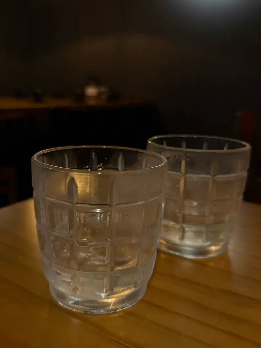 A glass of peach shochu served as a welcome drink