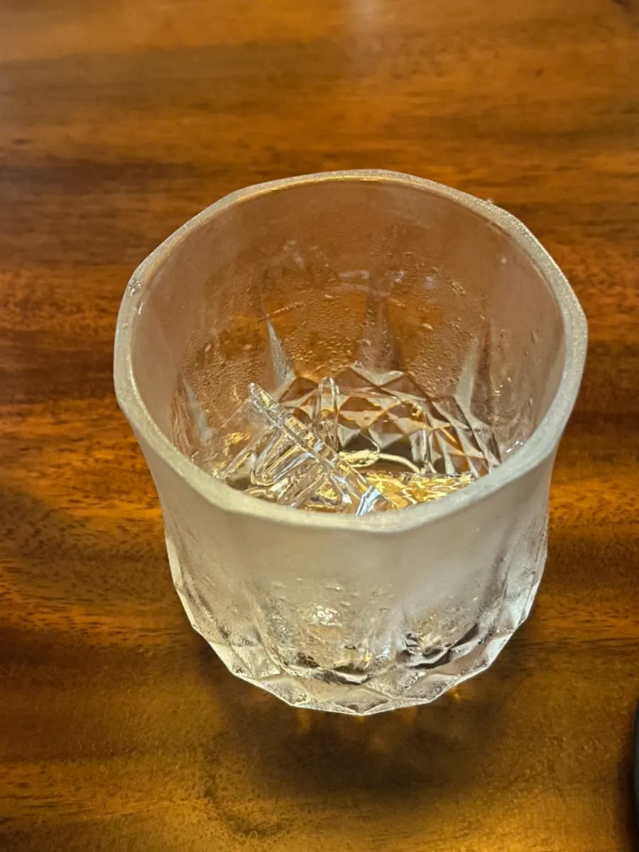A glass of peach-scented soju welcome drink