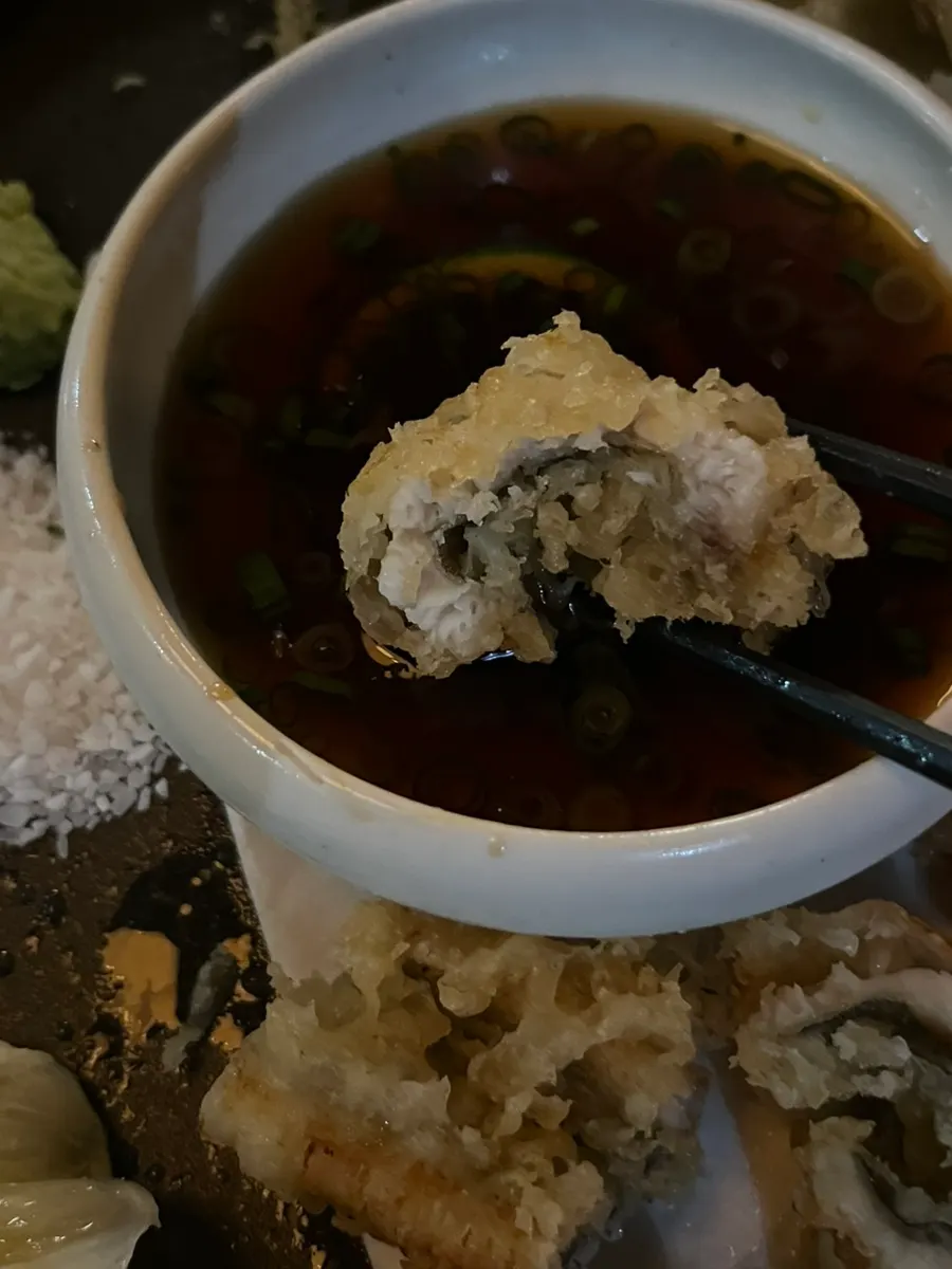 Anago tempura dipped in sauce