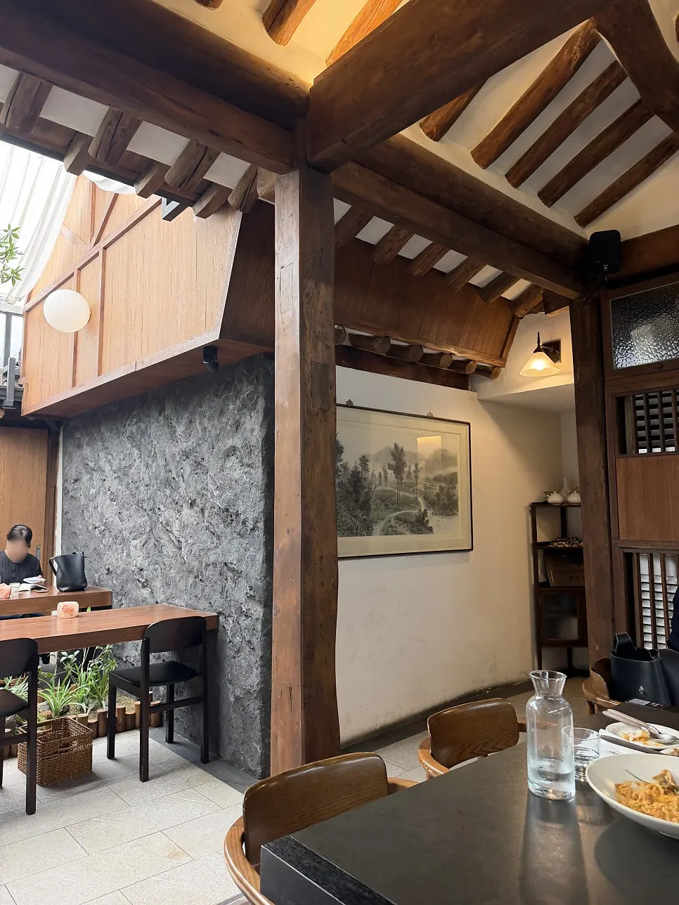 Interior of Concasse Anguk with visible hanok rafters